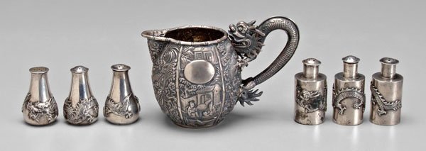 Seven pieces Chinese export silver:: chinoisserie-decorated pitcher with dragon handle, marks for Cumshing (Canton, 1780-1820), 3-1/2 x 5-3/8 x 3 in., [dents;] six salt and pepper shakers with dragons, marks for Wang Hing (Hong Kong, lat