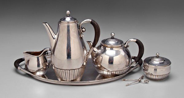Georg Jensen sterling tea service,: Johan Rohde design 45C, fluted ebony handles, 10-3/4 in. coffeepot with matching teapot, creamer, sugar, with 20-1/2 in. tray, design 251B, all with marks for Georg Jensen, Copenhagen, 1945-1977, 127.