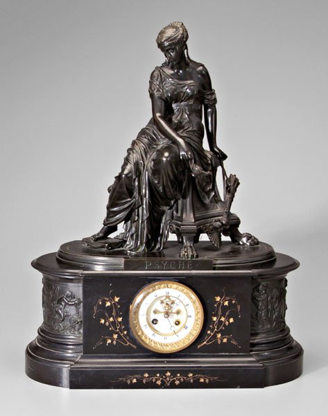 Bronze-mounted clock,: 16-1/2 in. bronze pediment of seated Psyche holding a lamp, quiver of arrows in other hand, bronze marked "CP" (possibly a foundry mark), clock face with open escapement flanked by intaglio cut panel 