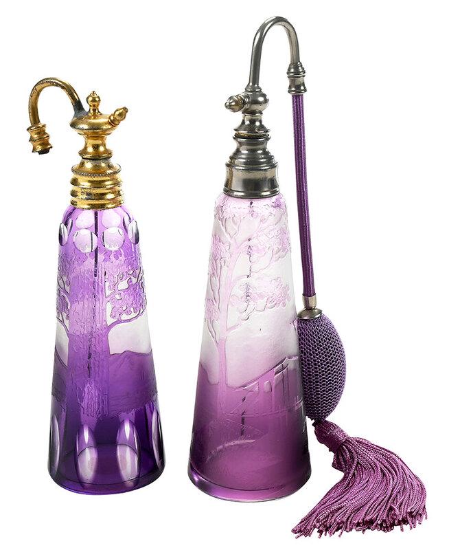 Two French Cameo Glass Amethyst Atomizers: 19th/early 20th century, one possibly Val St. Lambert, with etched mountain landscape and cut to clear panels, brass hardware, unsigned, 8 in.; atomizer with etched windmills in landscape, chrome hard