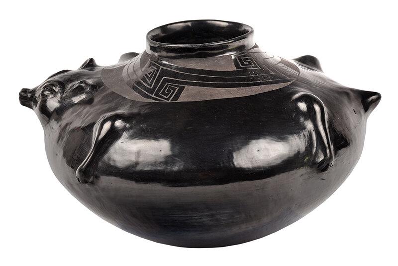 Reynolda Q De Lopez Blackware Badger Pot: Mata Ortiz, 20th century, signed on base "Reynolda Q de Lopez", with the distinctive raised relief badger and black on black geometric decoration, 6-3/4 i x 12 in. - Provenance: Private Florida Collec
