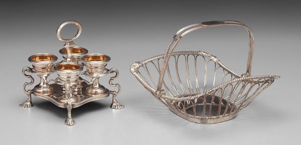 Old Sheffield plate egg cruet, basket:: rounded rectangular wirework basket, no monogram, 6-1/2 x 8 x 8-5/8 in., [bent;] egg cruet, four cups with gilt interiors, no monograms, 6-3/8 x 5-3/8 x 5-1/2 in., [repaired joints,] both unmarked, En
