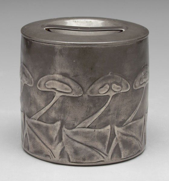 Tudric pewter biscuit box,: round with stylized Art Nouveau floral decoration, marked "TUDRIC", Liberty & Co., London, possibly Archibald Knox design, no monogram, 4-3/8 x 4-1/2 in. Wear, small dents, handle bent.