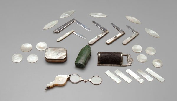 27 diminutive pieces:: 18 Asian gaming pieces, mother-of-pearl with fine etched decoration, rectangular, circular and almond shaped, 1-1/4 in. to 2-1/4 in., [excellent condition;] green shagreen case, probably for a perfume