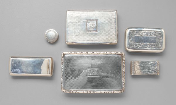 Six English silver boxes,: marks for Birmingham and Edinburgh, 1795 to 1831, gilt interiors: three rectangular, 2-1/4 in. to 3-1/2 in.; two shaped, 1-5/8 in. to 2-1/2 in.; one round only marked "JW", possibly American, 3/4 in.,