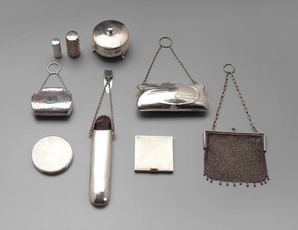 Nine silver items: chatelaine glasses case, Birmingham, 1898, 6-3/4 in.; three English purses, Birmingham, 1901 to 1915, 2-1/2 in. to 4-1/2 in.; two compacts, one English, Birmingham, 1934, and one gilt silver, 2-1/2 in
