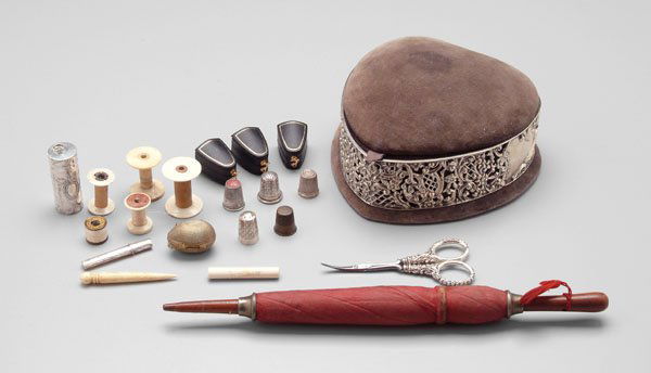 Twenty-two sewing items: sewing box with English silver band, 3-1/2 x 7 x 6-1/2 in.; five English silver thimbles; English silver scissors, 4-1/2 in. and needle case, 2-1/8 in.; silver thread case, "925", 2-1/4 in.; ivory nee