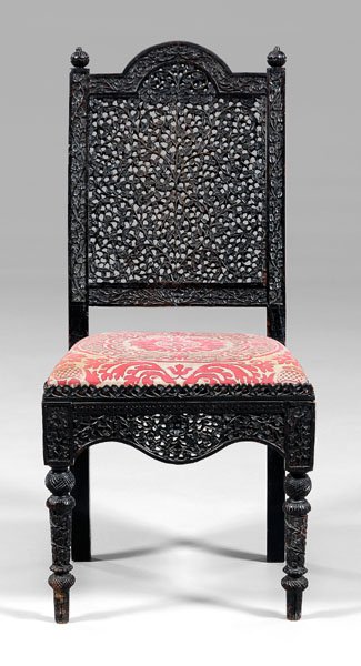 Anglo-Indian carved side chair,: elaborate foliate-carved back and seat frame, upholstered slip seat, probably late 19th century, 38 x 18 x 17 in. Generally good condition, scattered wear and losses to carving especially to slip seat