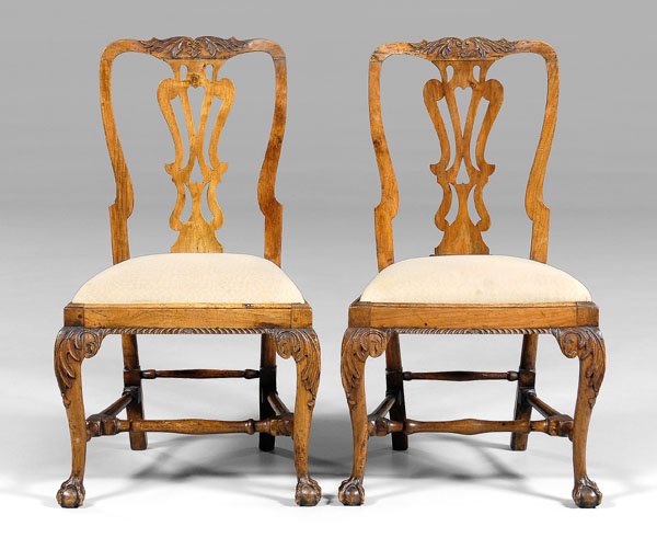 Pair Chippendale carved side chairs:: walnut and other mixed woods, each finely carved with pierced splat, acanthus-carved legs and ball-and-claw feet, British, mid 18th century, 38 x 21-3/4 x 15-1/2 in. Pest damage with associated losses