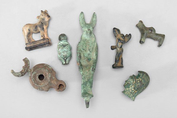 Seven ancient bronze fragments: bronze seated Anubis, Egyptian man god, 5-1/2 in.; winged figure, two quadrupeds, Roman head, oil lamp, later small figure of Venus with light green patination, 1-1/4 in. to 3 in., all probably first