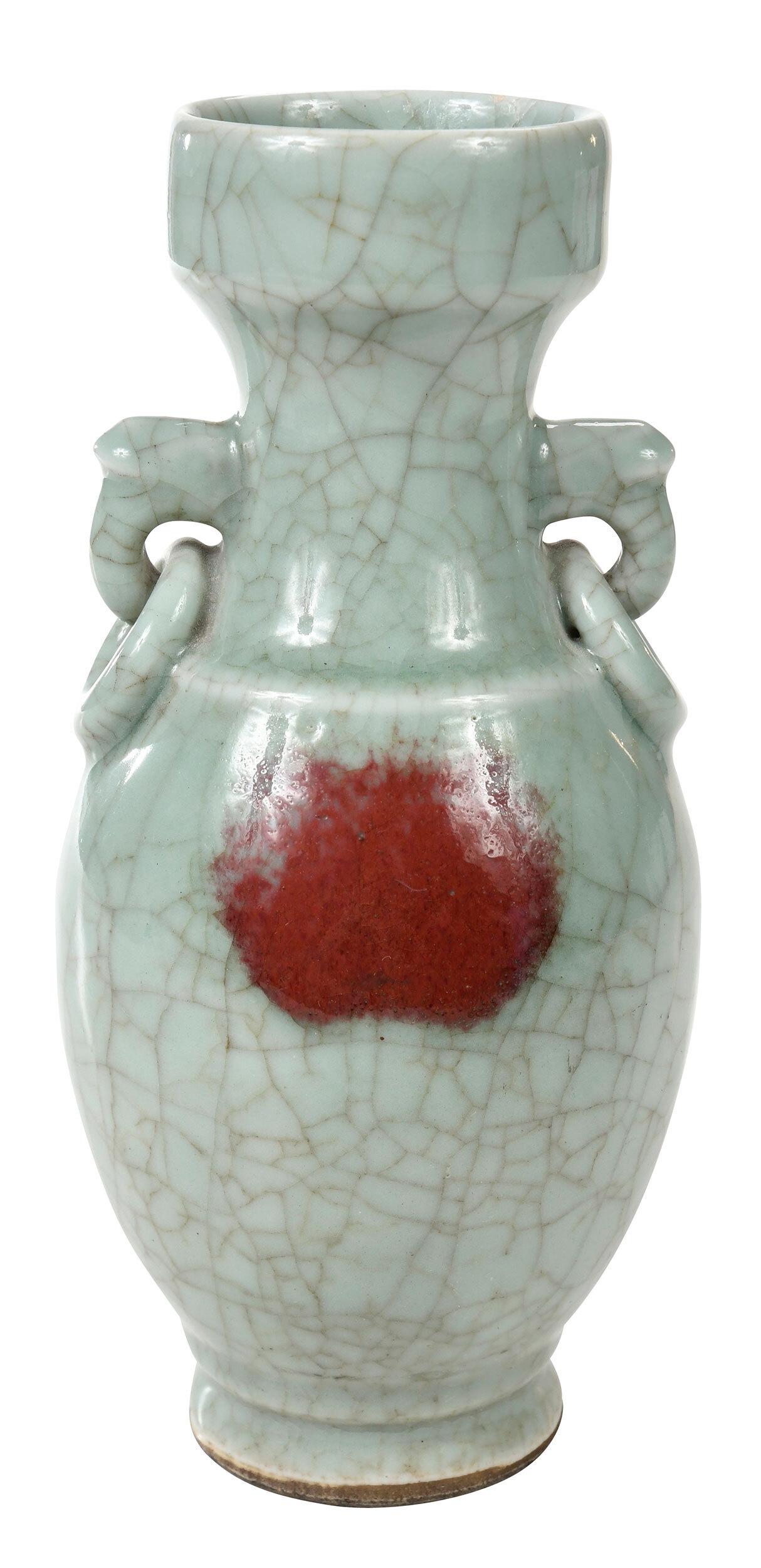 Chinese Crackled Celadon Baluster Vase: Qing dynasty, baluster vase with molded rim handles, covered all over in a celadon ge type crackle glaze, decorated with two copper red splashes on either side, 9-3/4 in. Provenance: James Kennedy Ant