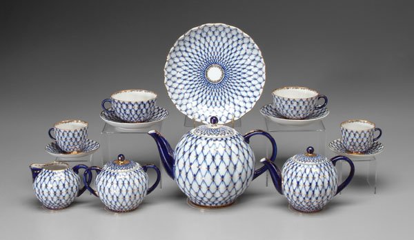 Russian porcelain tea service:: diamond latticework with cobalt and gilt highlights, marked "Made in USSR"; detailed listing available. Provenance: Collection of Earl Kuns and John E. Keeney, Iowa Falls, Iowa.