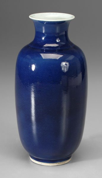 Chinese blue-glazed vase,: rich blue glaze thinning at neck, pooling at foot, white rim with blue splotches, tall foot ring partially unglazed, 18th or 19th century, 10-5/8 in. Base with old paper label and star crack, minor ri