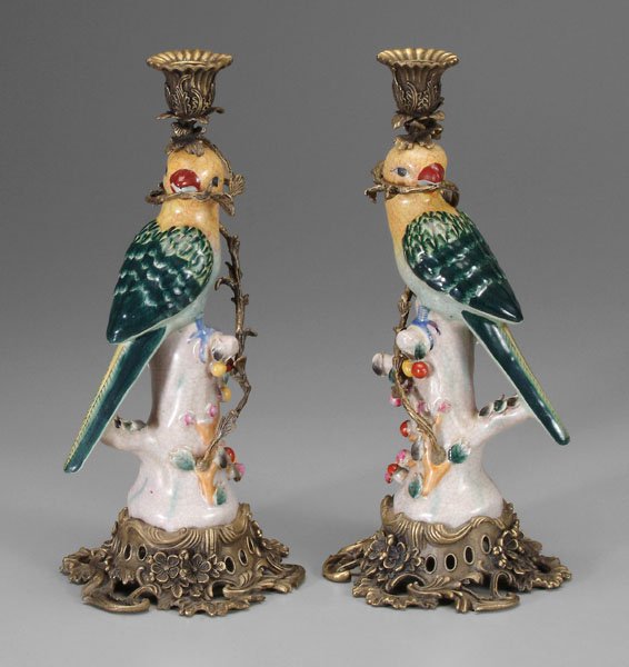 Pair Chinese export style: candlesticks: mirror images, birds perched on tree trunks with berry-laden vines, brass French style bases, brass vines mounted at trunks, wrapping around birds' heads to end in cups, contemporary, 14