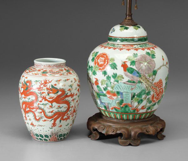 Two pieces Chinese [famille verte:]: ovoid vase with five dragons over waves, base with blue six-character mark for Wanli (1573-1619) within two circles, 19th century, 8-1/8 in.; lidded jar with exotic bird among flowers, base stamped in