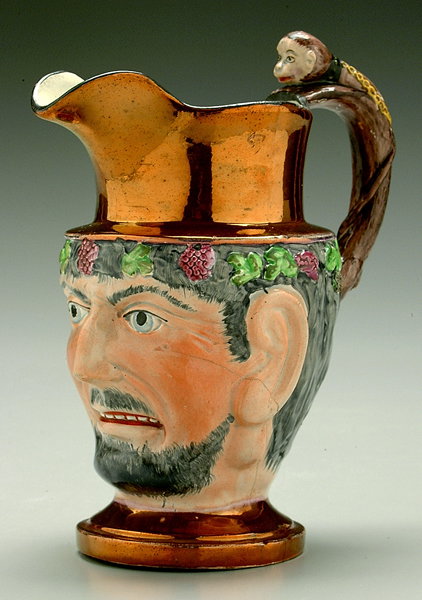 Copper luster satyr jug,