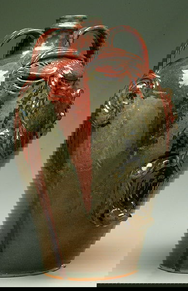 Billy Ray Hussey face jug,: three handles with ears, eyes, exaggerated nose, open mouth with tongue sticking out, alkaline glaze with runny red, marked on bottom "BHC Always take life slow, you'll see more that way!" and 7 insid