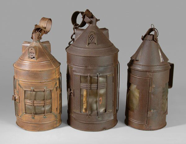 Three tin lanthorns (lanterns),: all with horn windows: three pierced dormer ventilators on conical top, windows with wirework grille,18 in. excluding chain, [scattered rust and losses, small dents, some windows damaged and warped;]