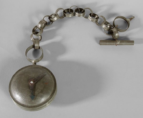 Tole advertising watch and chain,: formed as oversized pocket watch with fob and chain, watch with movable hands, Pennsylvania, late 19th century, 21-1/2 in. Paint numerals faint, otherwise good condition, key with losses to tip. Prove