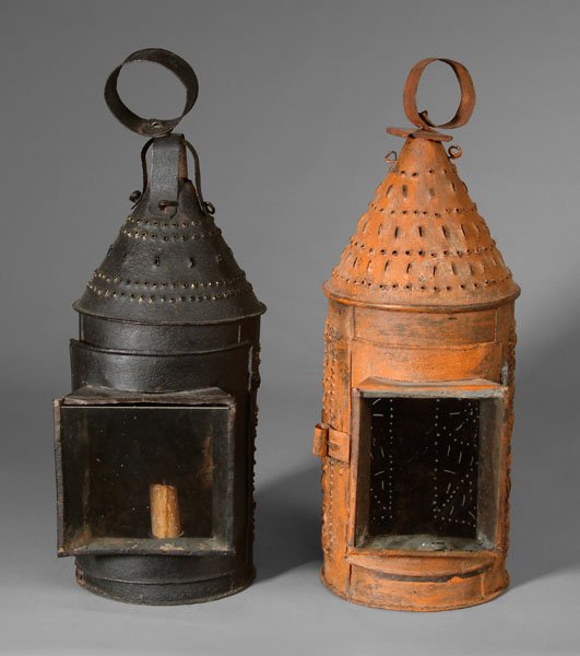 Two similar punched tin lanterns