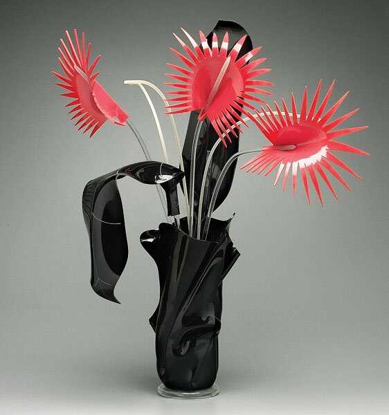 Van Teal acrylic flowers,: Van Teal acrylic flowers, arrangement with three red flowers and two black leaves, three plastic rods, in similar black vase, marked on one side "Van Teal," 36 x 30 x 12"