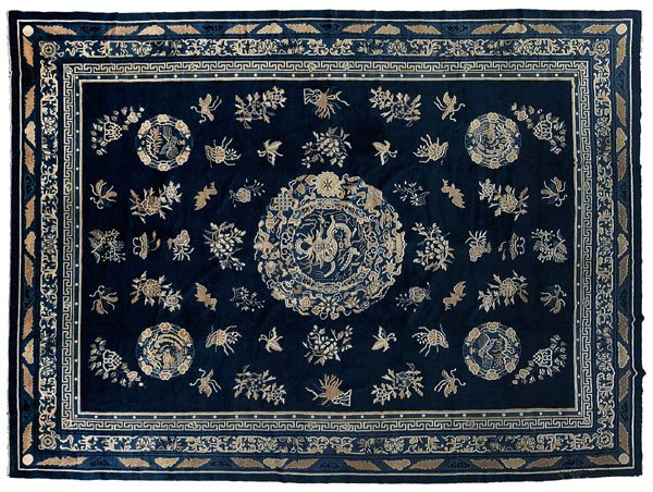 Chinese Peking rug,: central medallion with dragon surrounded by Buddhist symbols, blue field with repeating circular medallions with exotic birds, bats, butterflies and floral bouquets, multiple Greek key, cloud and bat 