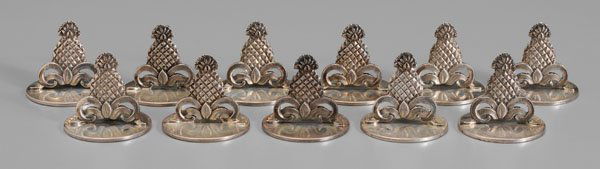 Set of Tiffany sterling place card: holders: pineapple and scroll decoration, marks for Tiffany & Co., no monogram, mid to late 20th century, 6.83 oz.T., 1-1/4 x 1-1/4 in., (11 pieces). Some with weakness at bases.