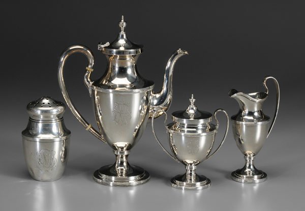Four pieces Baltimore sterling silver:: three-piece coffee service, urn forms with reeded borders, 10-1/4 in. coffeepot with matching lidded sugar and pitcher, marks for S. Kirk & Son Co. (1903-1924), monograms, [sugar lid rim bent;] urn-fo