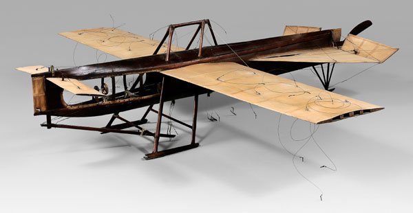 Canard aircraft test model, 1910-1920,: submarine-shaped hull intricately constructed of steam-bent mahogany veneer nailed to pressed cork ribs, convex-curved wings, control surfaces, and canard covered in fine denier linen, wings and tail 