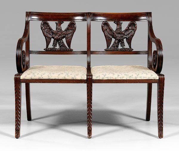 Duncan Phyfe style eagle-carved settee: with spread-wing eagle double chair backs, rolled arms, leaf-carved saber legs, American, late 19th/early 20th century, 32 x 37 x 19-1/2 in. Good condition overall with scattered surface wear and abra