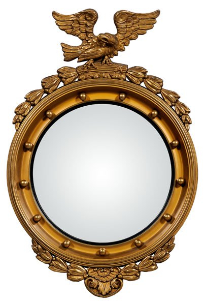 Federal style bull's-eye mirror,: spread-wing eagle and bellflower crest, early 20th century, 35 x 23-1/2 in. Scattered chips and losses to gesso, other surface retouch.