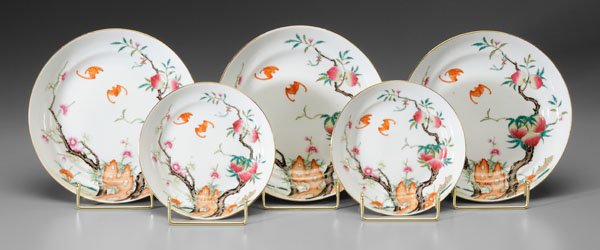 Five Chinese [famille rose] bowls:: interiors with iron-red bats between prunus and peach trees, the latter with five peaches, exteriors with four iron-red bats, bases with blue [Qing Hua Zhen Pin] mark (Precious Object of Splendor), th