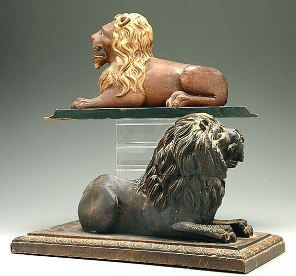 Two carved wood lions
