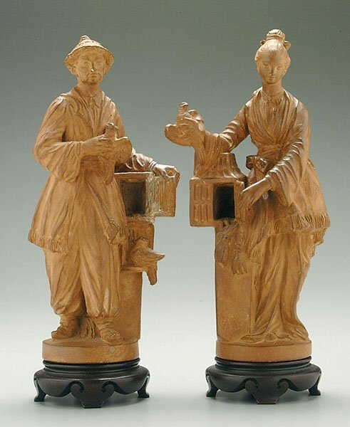 Pair Borghese molded ceramic figures,