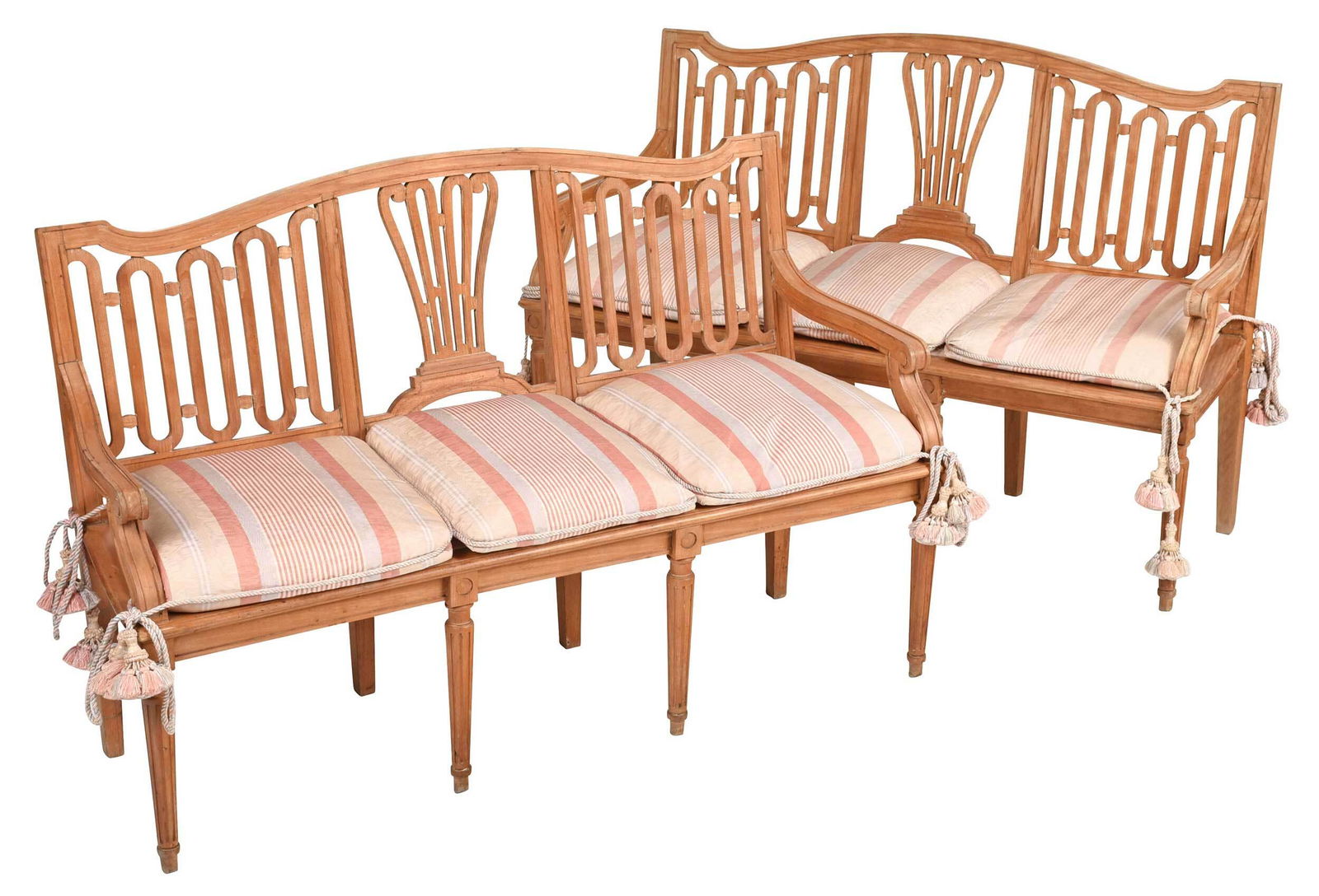 Pair of Provincial Louis XVI Beechwood Settees: each with arched crest and pierced backs, silk upholstered seat set with triple cushions, on turned and reeded front legs, 35-1/2 x 58 x 21 in. , Provenance: Estate of Brock Arms, Flat Rock, North Car