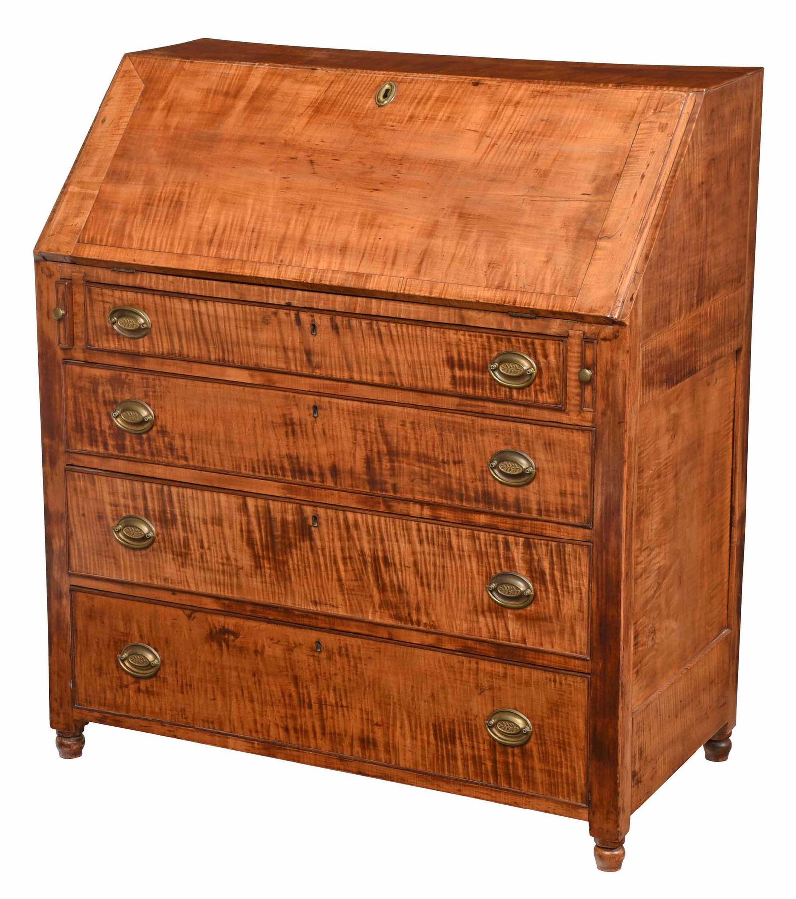 American Federal Tiger Maple Desk: 1800-1820, highly figured maple throughout, slant lid opening to fitted interior with 15 small drawers, over four dovetailed long drawers, on turned feet, paneled sides and back, pine secondary throug