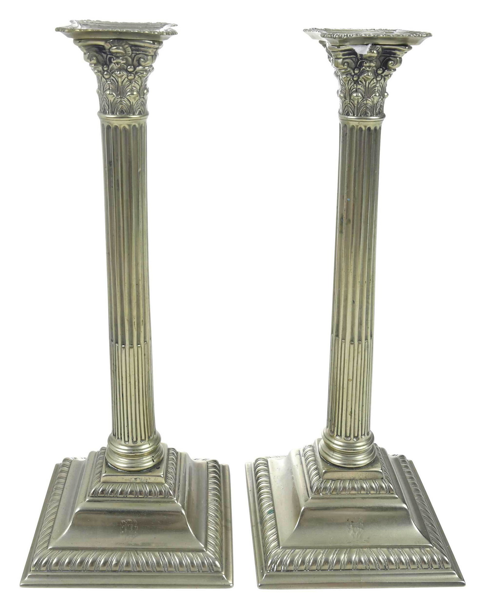 Pair of Georgian Column Form Paktong Candlesticks: English, probably late 18th century, each of Corinthian column form, stop fluted, stepped square bases with gadrooned borders, faint engraved design on base, with gadrooned bobeches, 11-7/8 x 4-7/8 x 