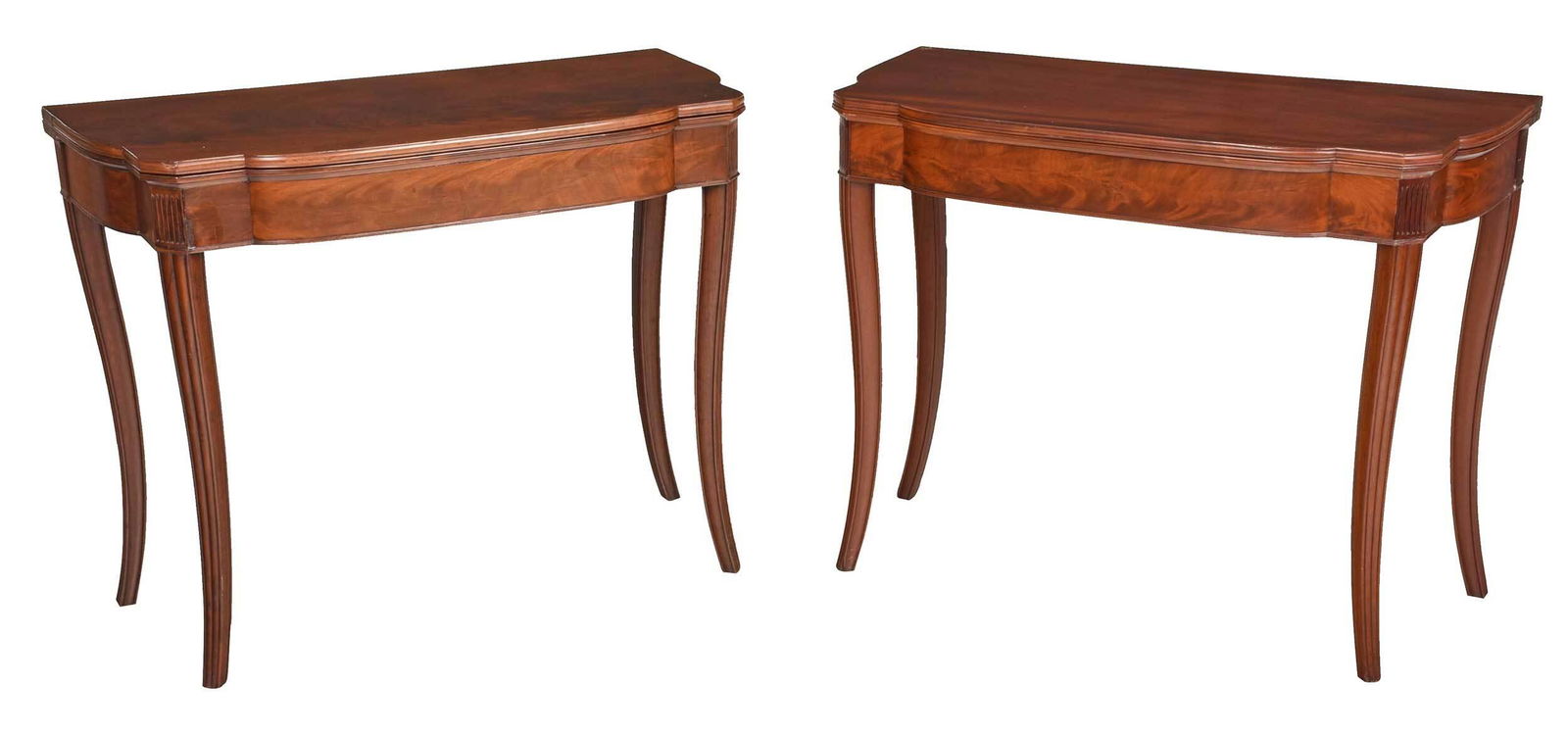 Pair New York Federal Figured Mahogany Card Tables: possibly shop of Duncan Phyfe, circa 1815, each with figured top with molded edge, two gate legs, figured veneered skirt with fluted corners, on molded and shaped legs, underside of one table with ill