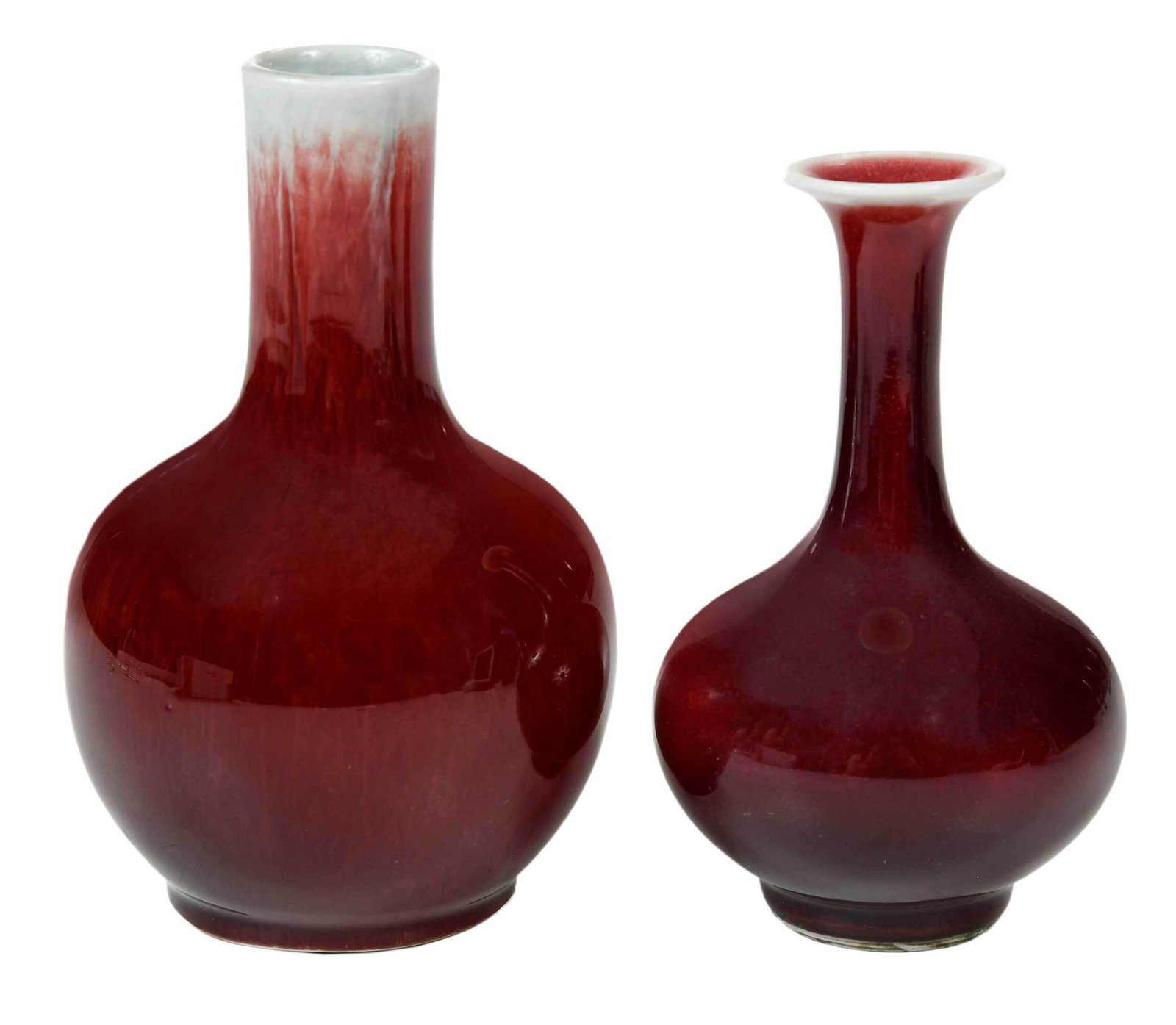 Two Chinese Sang de Boeuf Bottle Vases: bulbous long necked forms in dark red glaze, 5-1/2 in. and 6-3/8 in. Provenance: Private Collection, Milledgeville, Georgia