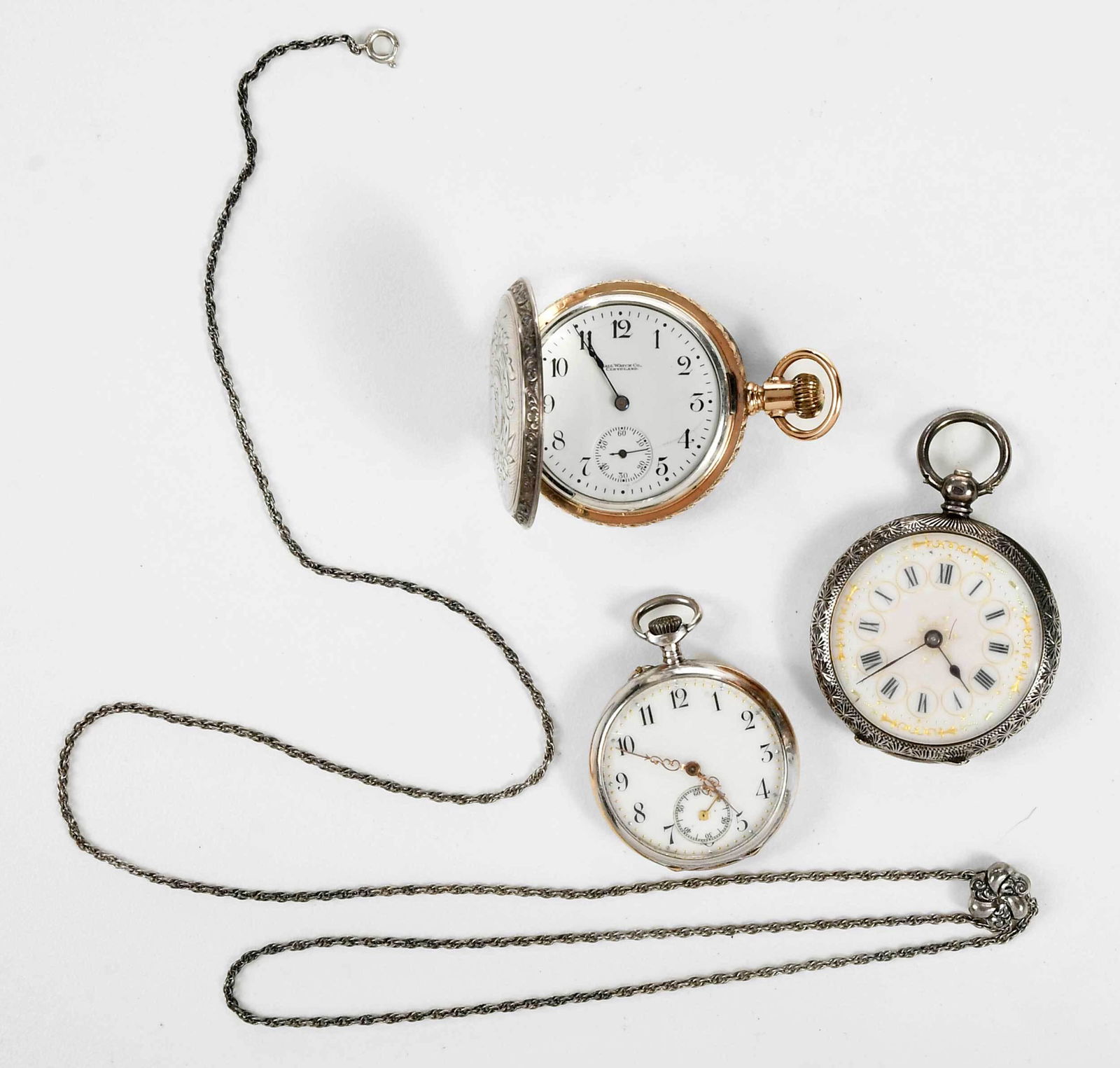 Three Pocket Watches: 36mm open face case, inside case stamped "5548, 0,935" and with hallmarks, silver case, 33.5 grams; 30.5mm case, watch with chain, cuvette engraved "J. Pourrat & Fils, Geneve", silver plated, 23.5 gra