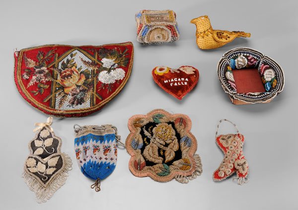 Nine Victorian beadwork whimsies: teapot cozy, floral design on red wool ground, 11 x 14-1/2 in.; watch case, 7-1/2 x 4-1/2 in.; Niagara Falls heart pincushion, 5-1/2 x 6 in.; drawstring purse, 6-1/2 in.; boot-shaped pincushion, 5-1/2
