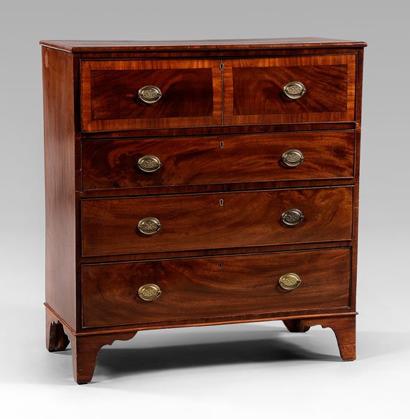 Hepplewhite inlaid mahogany butler's: desk, figured mahogany veneers, dovetailed construction, top drawer with fold-down front and fitted interior, original bracket feet, British, 19th century, 45 x 41-1/4 x 20 in. Warping to top drawer f