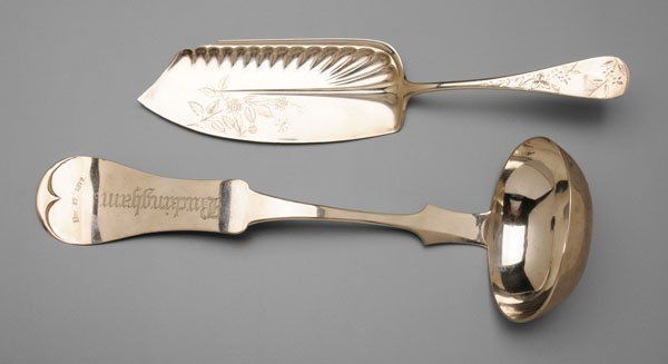 Two pieces Duhme & Co. silver: sterling Lily fish server, inscribed on back "1861/h/1886", 11-3/8 in., [tip bent;] coin silver Tipped ladle, inscribed "Buckingham" and "Dec. 25, 1872", back inscribed "E. M. and C. B./From/Mother.",
