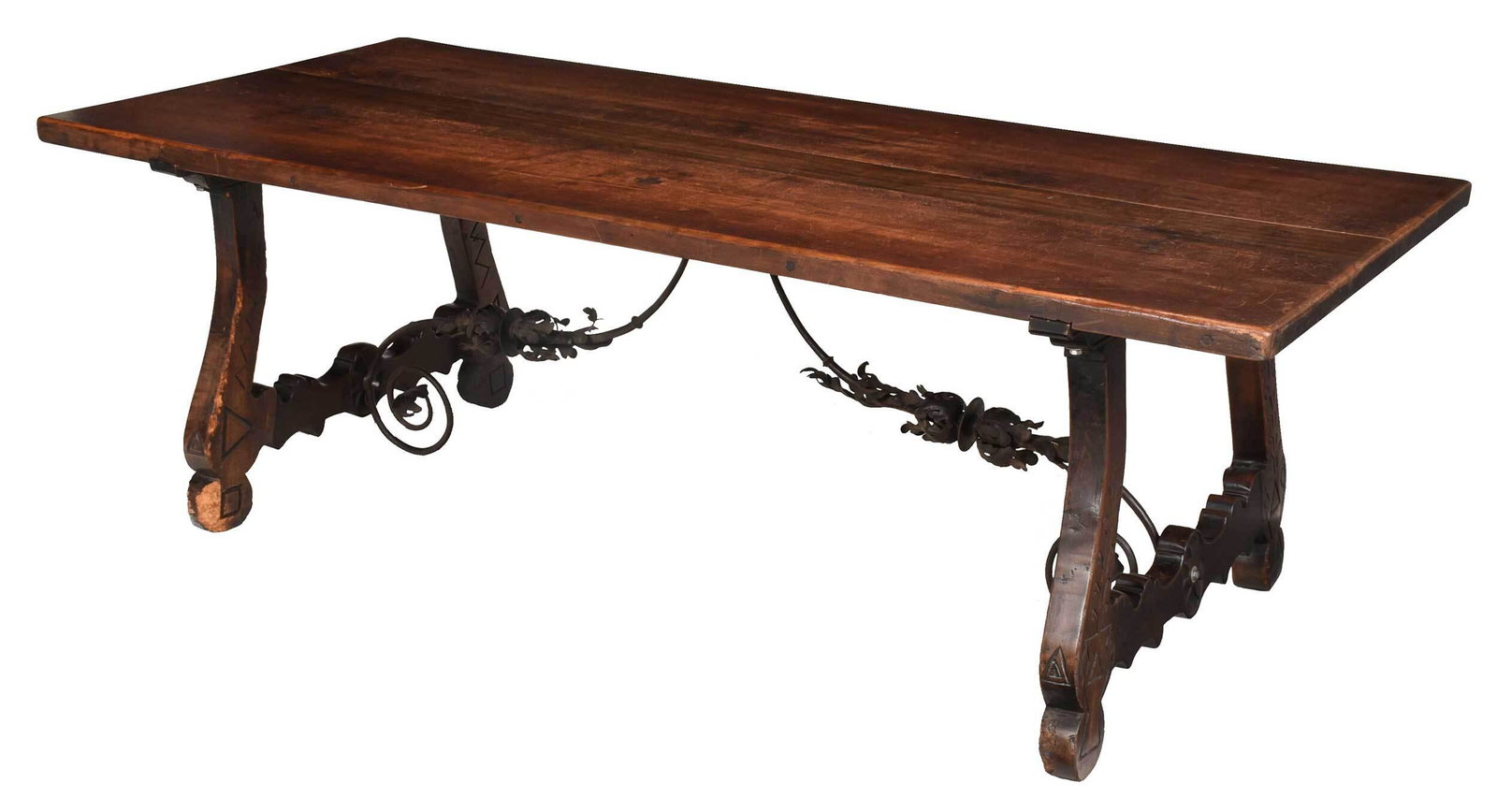 Large Spanish Baroque Style Walnut and Iron Refectory: Continental, 19th/20th century, thick walnut top over trestle form base with scrolled walnut legs, centering scrolled and leaf decorated wrought iron stretchers, 30-1/2 x 41 x 92 in. Provenance: Humbe