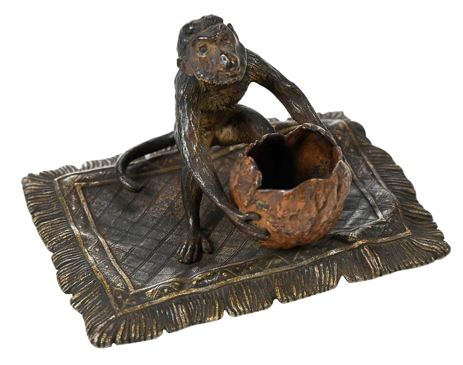 Franz Xavier Bergmann: (Austrian, 1861-1936) Monkey Holding a Walnut Shell, seated on a carpet, possibly a match safe, stamped underneath "F. Bergmann", with foundry stamps "Geschutze. 459" and other marks, cold painted and