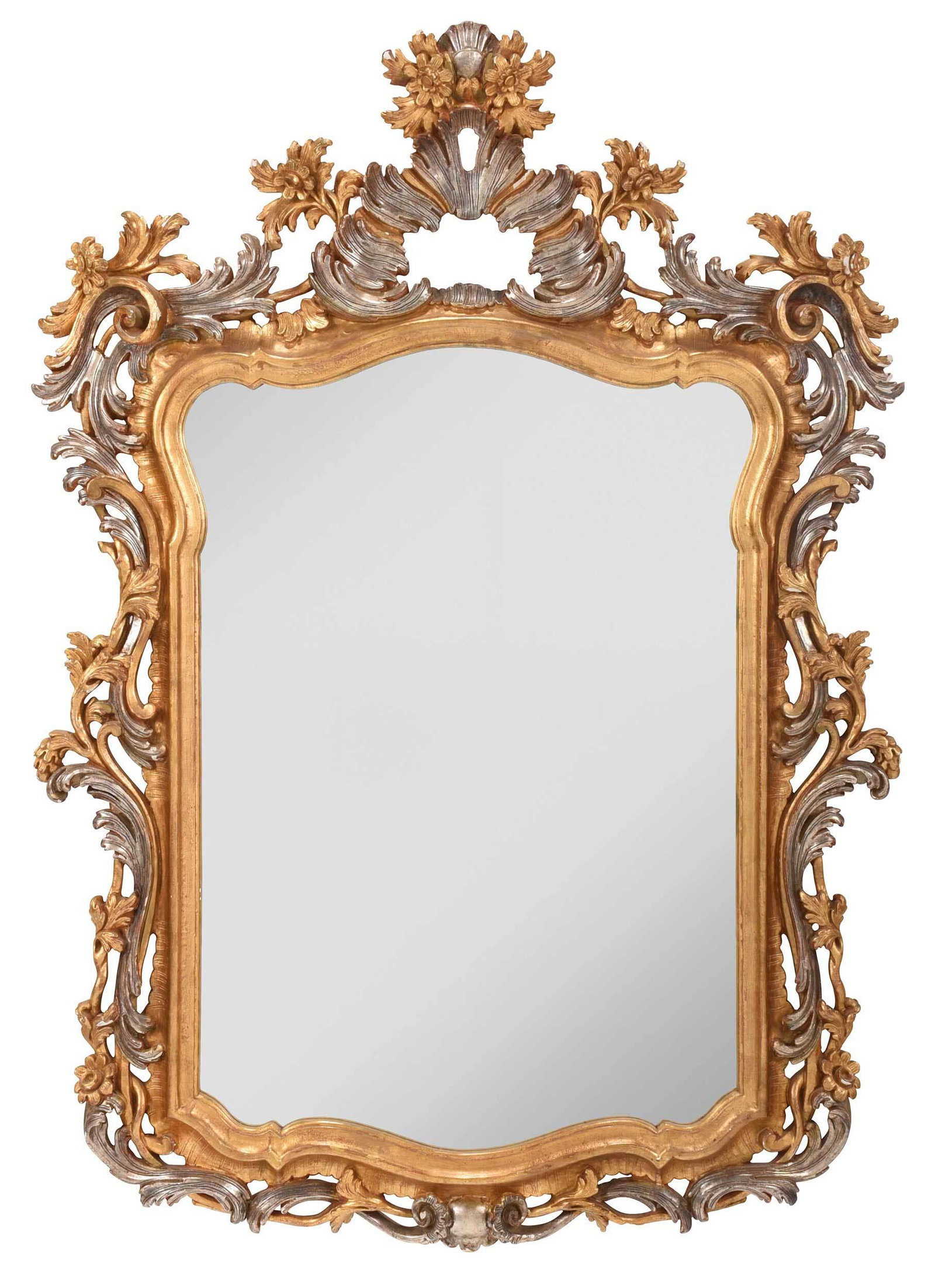Baroque Style Carved, Silvered, and Gilt Beveled Mirror: Italian, late 20th/21st century, well carved frame with leaf, rosette, and scroll decoration, cartouche form beveled mirror plate, back marked "made in Italy", 55-1/2 x 40 in.