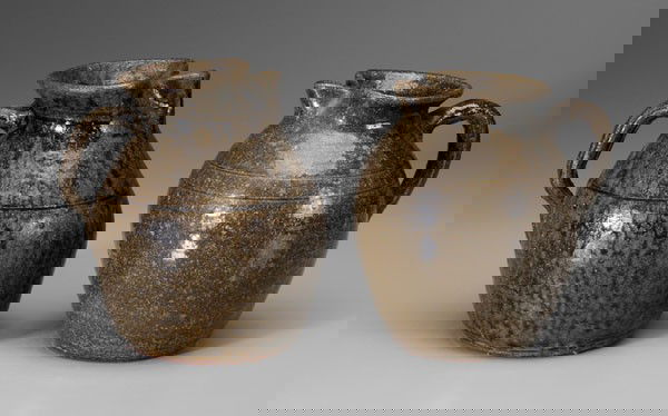 Two Lanier Meaders Pitchers: Georgia, 20th century, one with medium olive alkaline glaze, pinched spout, incised bands, inscribed on base "Lanier Meaders", (White County, Georgia, 1917-1998), and "5" within a circle, 8 in.; one w