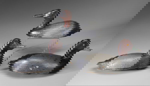 Three Chris Smith Decoys: all drakes, glass eyes: one hollow-body canvasback, 15-1/2 in., [old repaint with minor chips and wear, lacking weight,] Provenance: Possibly Goldberger; one hollow-body redhead, rounded lower jaw, or