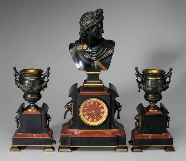 Fine Bronze Clock and Garniture: French, early 19th century, clock with patinated bronze bust of male classical figure over architectural base, Egyptian style ornamentation, polished slate and red marble mounts, animal head mounts on