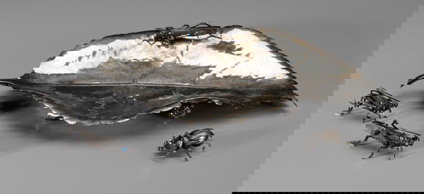 Buccellati Silver-Plated Leaf, Insects: leaf with pinecone style feet with marks for Buccellati, inscribed "Rome/1955", three grasshoppers (one attached), and one beetle, blue stone eyes, insects unmarked, leaf 14-1/4 in., insects 2-1/4 in.